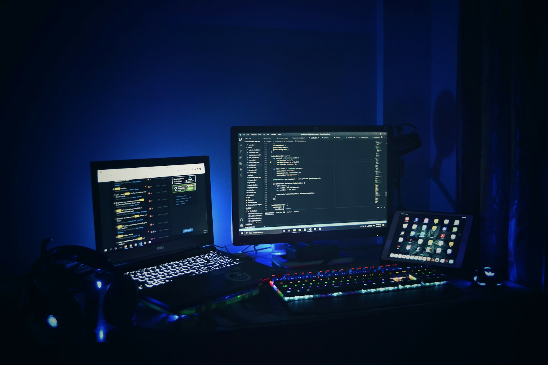 black laptop computer turned on beside black computer keyboard